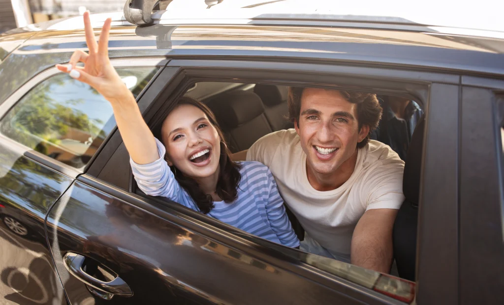 cheerful smiling millennials enjoying car ride mu 2023 11 27 05 14 55 utc